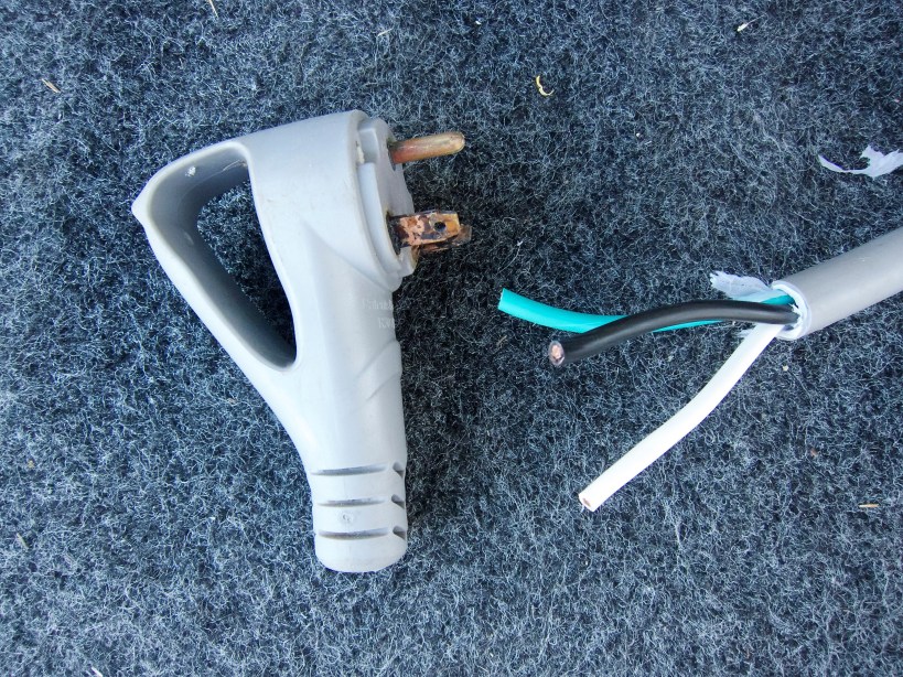 The damaged plug, whacked from the cord