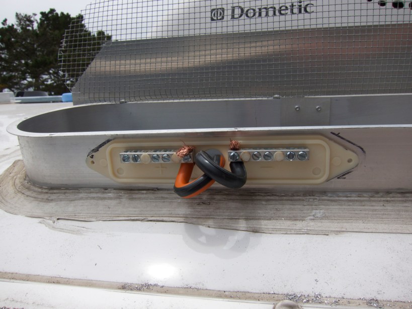 Rooftop junction box combines individual panel wires (10/2 awg) into a single heavy-guage wire (6/2 awg)