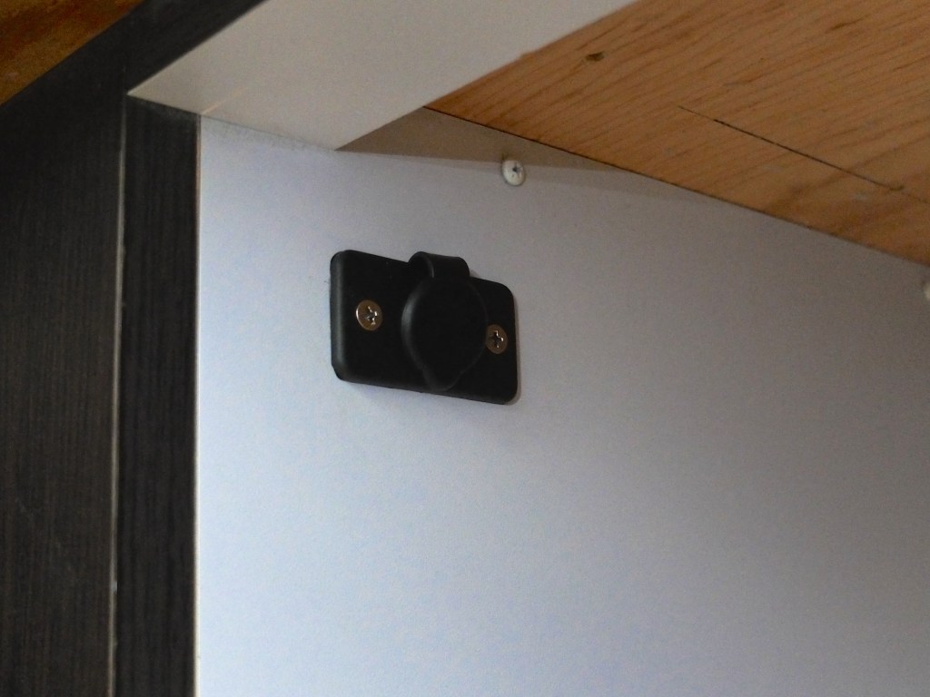 The socket installed under the bed, next to the nightstand